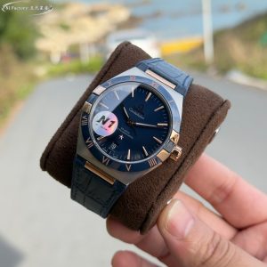 N1 Factory Masterfully Crafted Omega 41mm Master Chronometer (Fifth Generation Constellation) 131.30.41.21.99.001 Series N1 Factory upholds an uncompromising pursuit of horological artistry. By acquiring authentic originals for in-depth study, we integrate modern cutting-edge techniques and advanced materials to meticulously refine every detail, faithfully recreating the iconic essence of the Omega Constellation collection.   Featuring an exclusive genuine 8900/8901-compatible dual-time zone quick-set calendar movement, the original 6-position balance wheel undergoes meticulous finishing. This ensures not only stable and reliable performance but also showcases the exquisite artistry of mechanical watchmaking. The case employs the latest CNC technology for precise dimensions and refined textures. Front and back sapphire crystals complement each other, presenting a perfect fusion of quality and aesthetics from every angle.The dial hands employ advanced PVD coloring techniques. The enigmatic multicolored meteorite dial harmonizes with the classic dial face, complemented by vibrant titanium and ceramic bezels that blend contemporary flair with timeless elegance.The butterfly folding clasp with quick-adjust functionality mirrors the original design, offering excellent weight and tactile feel for an unparalleled wearing experience. N1 Factory presents the most comprehensive and highest-grade version of the classic 41mm fifth-generation Constellation, paying homage to tradition while continuing the legend.